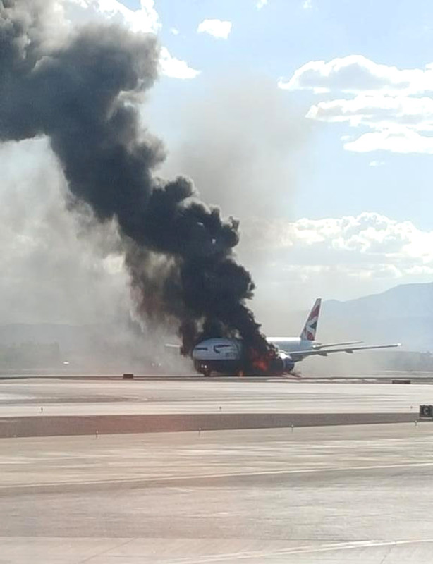 epa04921112 A handout photo from Twitter user Bradley Hampton used with permission shows British Airways flight 2276 en route to London's Gatwick Airport on fire at McCarran International Airport in Las Vegas, Nevada, USA, 08 September 2015. Media reports indicate that the Boeing 777's engine caught fire and that all 159 passengers and 13 crew were evacuated with just two minor injuries reported. EPA/BRADLEY HAMPTON via TWITTER HANDOUT EDITORIAL USE ONLY/NO SALES